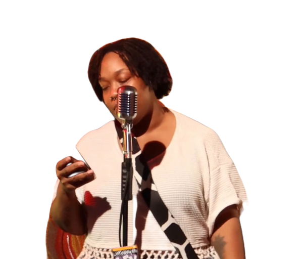 Penny Simmons performing spoken word at a microphone